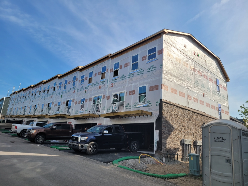 Townhome complex before siding, wrapped in house wrap