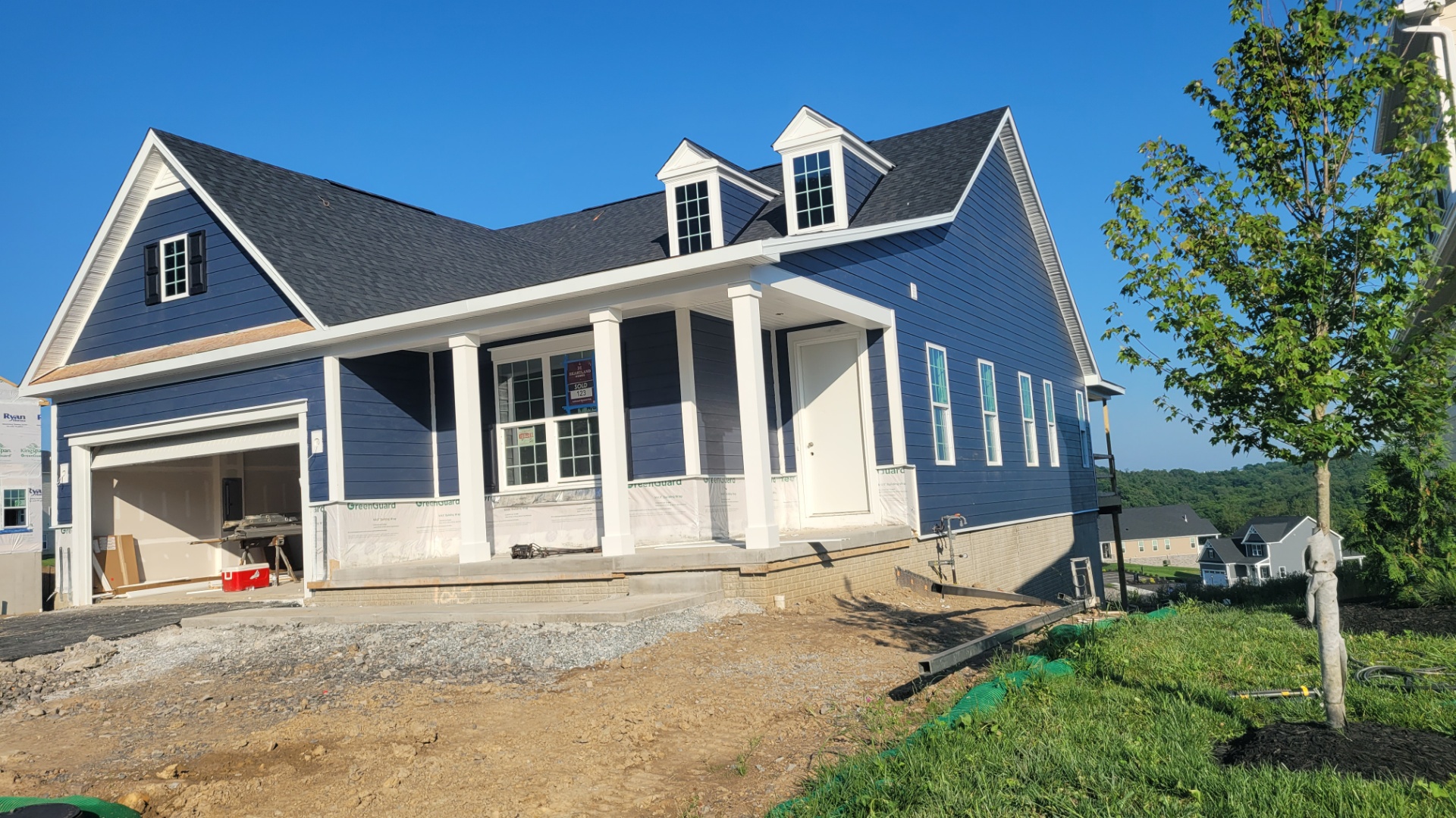 New construction home with blue lap siding