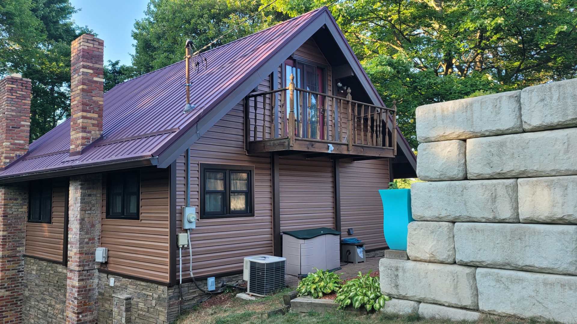 A-frame cabin style home with vinyl siding