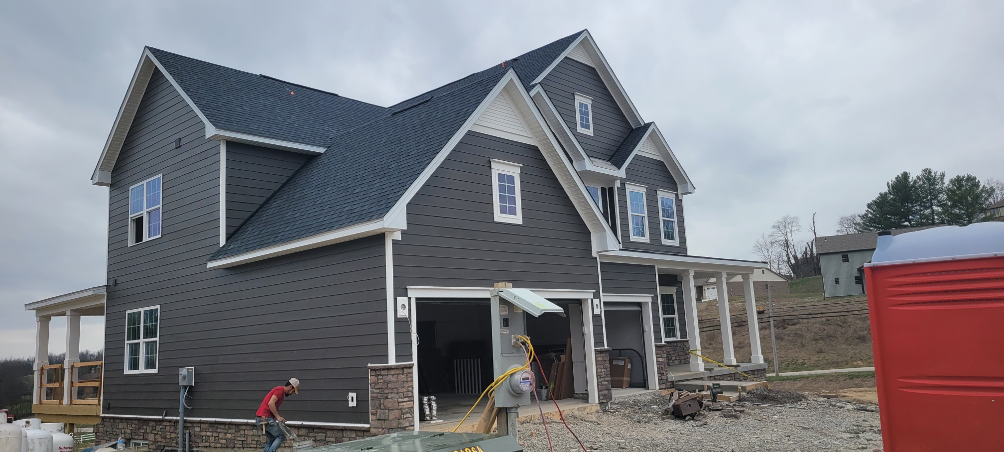 Townhome exteriors with siding and stone accents