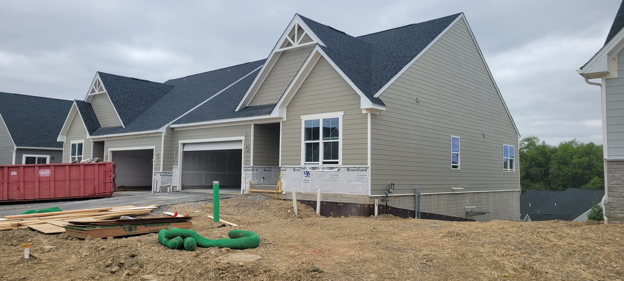 New construction two story homes with siding installed